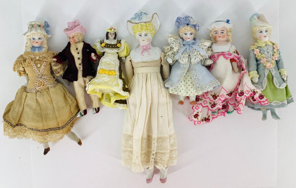 Lot (7) Bisque Bonnet Head dolls. Includes five with (1 of 1)