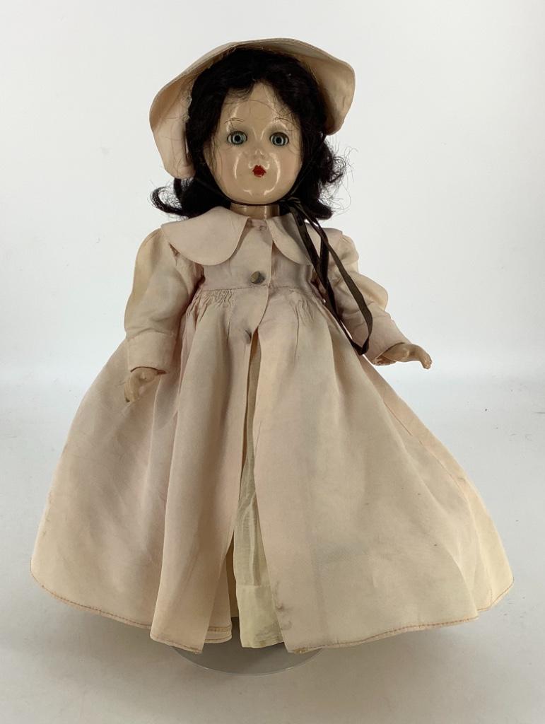 14" vintage Madame Alexander all composition all: 14" vintage Madame Alexander all composition all original Scarlett O'Hara. Black human hair wig, blue/green sleep eyes and closed mouth; on five piece composition body. Dressed in tagged pink over-coa