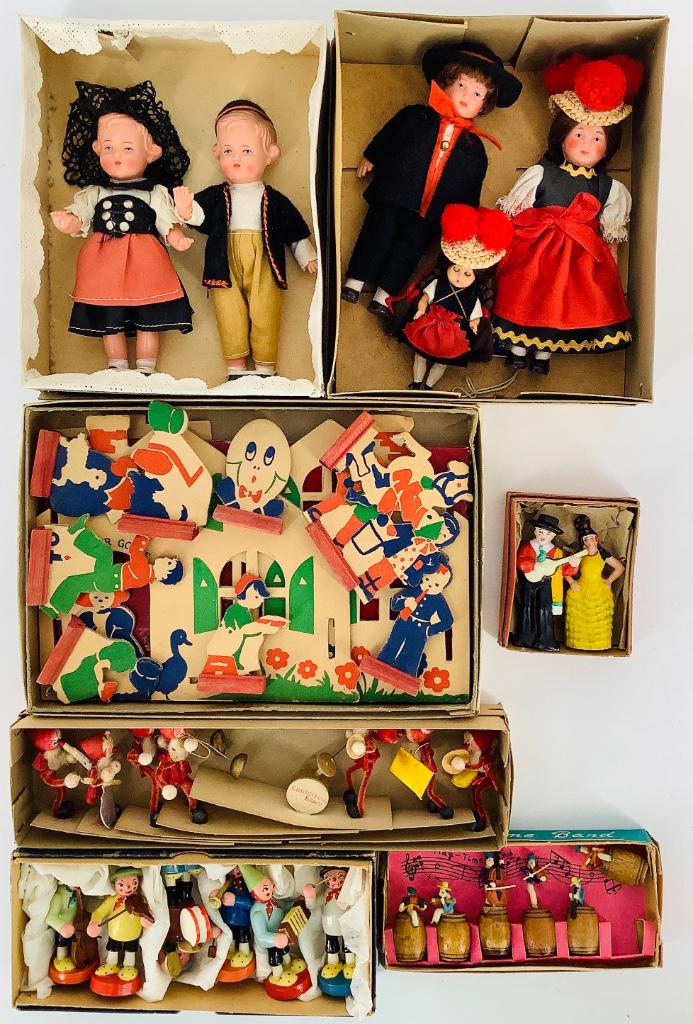 Lot (7) boxed novelties. Includes three plastic dolls (1 of 2)