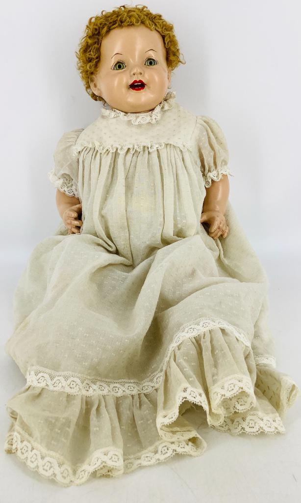 21" Effanbee Luvums composition baby. Caracul wig over: 21" Effanbee Luvums composition baby. Caracul wig over molded hair, sleep eyes, open mouth with teeth, on plump cloth body with composition lower arms and legs. Nice finish to composition, some spotti