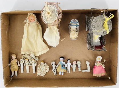 Lot of German and Japan all bisque dolls and (2) frozen: Lot of German and Japan all bisque dolls and (2) frozen Charlotte china dolls; 2" and 3" with gold painted shoes and original clothes. All bisque dolls include babies in metal carriages, 3½" bo