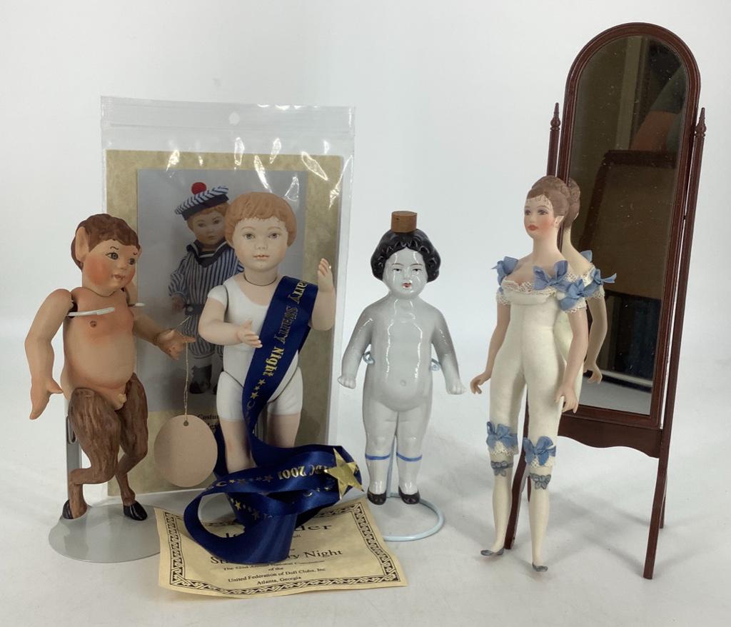 (4) UFDC souvenir dolls including 7Â½" all porcelain: (4) UFDC souvenir dolls including 7½" all porcelain "Pan" by Sandra Wright Justiss, 8¾" porcelain shoulder head "Janette" by Fawn Zeller with her full length mirror, 8" all porcelain "Al