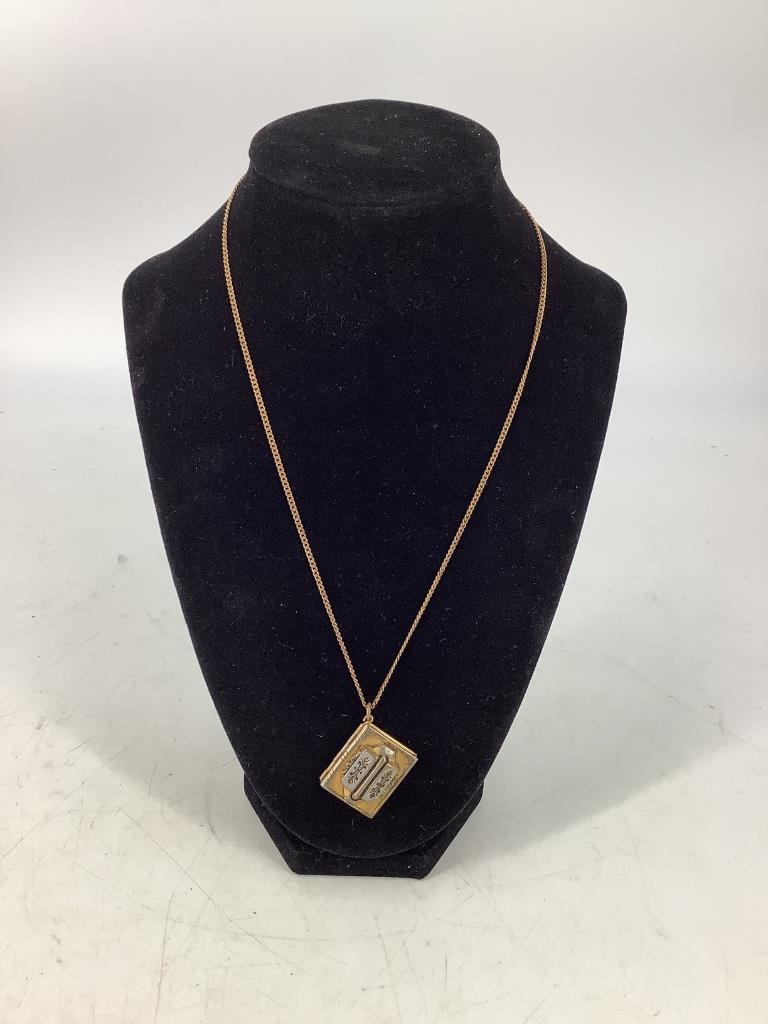 Vintage Necklace with Locket Pendant: Vintage Necklace with Locket Pendant 18' princess length gold tone metal chain (curb-link) with spring ring clasp closure. 1" x 0.75" booklet style locket ft. high relief design (some wear to metal) w