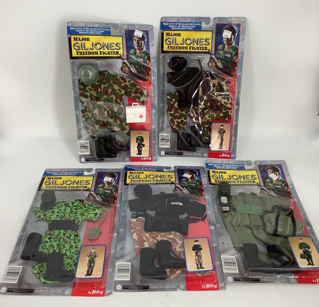 (5) Totsy Major Gil Jones Freedom Fighter outfits in: (5) Totsy Major Gil Jones Freedom Fighter outfits in original packaging as shown. Made to fit 12" action figures including G.I. Joe. Tops of packaging have been bent.