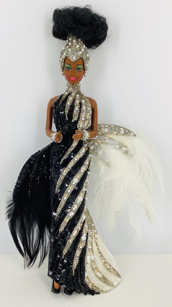 (1) STARLIGHT SPLENDOR BARBIE by Bob Mackie which is: (1) STARLIGHT SPLENDOR BARBIE by Bob Mackie which is 2nd in his series. Very small tear on top front of box and minor wear