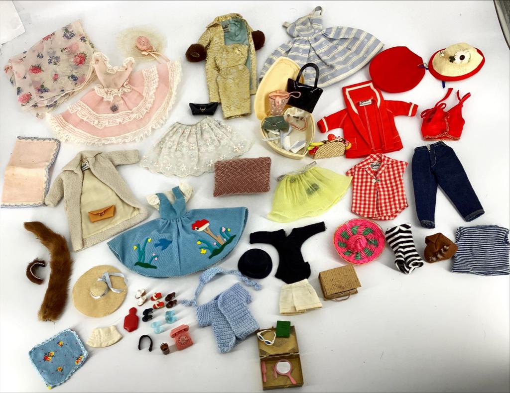 Very nice array of vintage Barbie clothing and: Very nice array of vintage Barbie clothing and accessories. A few Mommy made outfits also included .