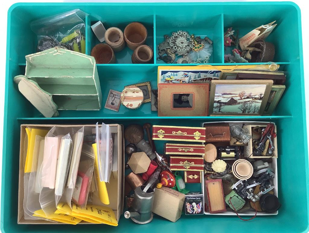 Green tray of miniature doll items. (1 of 1)