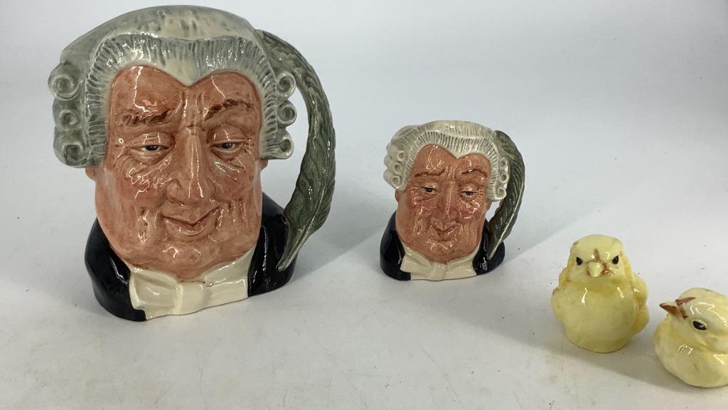 2 Royal Doulton Lawyer character jugs, 7-1/2â€ and: 2 Royal Doulton Lawyer character jugs, 7-1/2” and 4-1/2”. There are also two Goebel chick figurines.