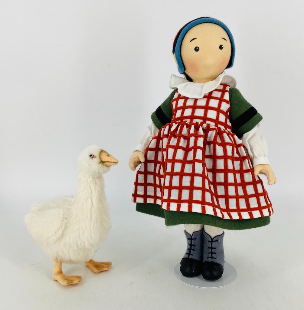 "L'Enfance de Becassine" by R. John Wright. 11 1/2": "L'Enfance de Becassine" by R. John Wright. 11 1/2" fully jointed all felt doll with molded and painted facial features, applied mohair wig, dressed in felt and cotton provincial costume with felt and