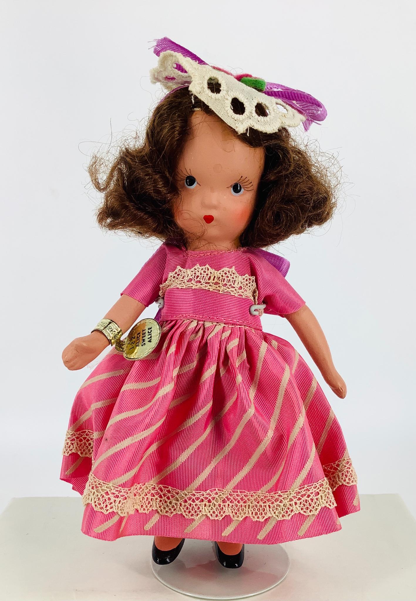 1940's 5 1/2" bisque Nancy Ann Storybook "Alice Sweet: 1940's 5 1/2" bisque Nancy Ann Storybook "Alice Sweet Alice" doll. In original untagged outfit, original tag, jointed arms, mohair wig, original box.