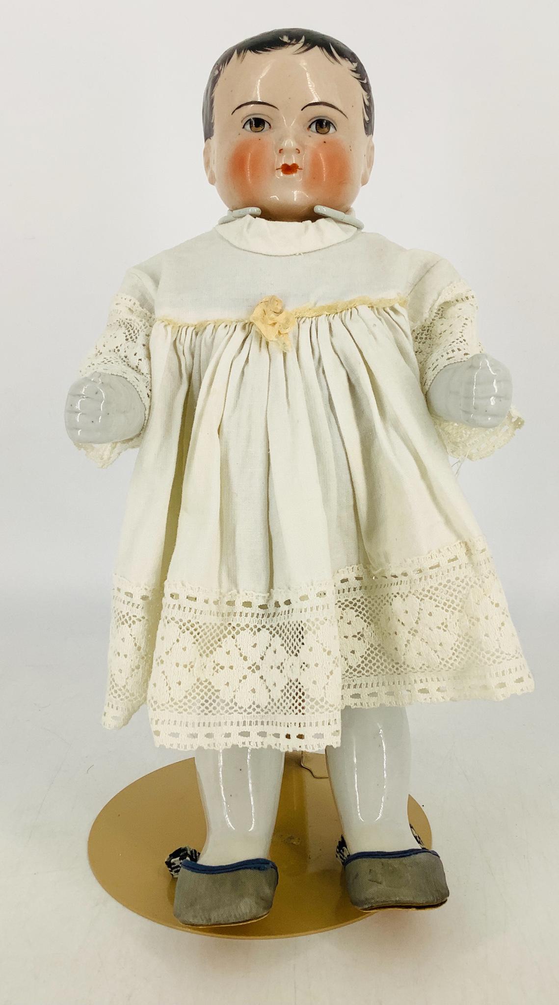 Large china "Frozen Charlie" with pink tint face. 14" (1 of 1)