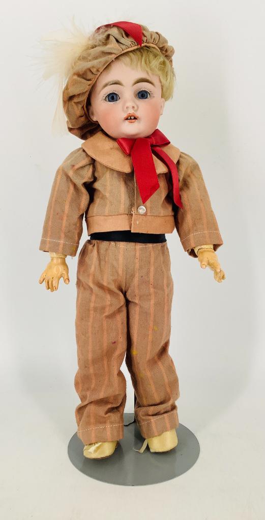 Kestner 143 bisque socket head boy. 13" doll with: Kestner 143 bisque socket head boy. 13" doll with likely original mohair wig on plaster pate, glass sleep eyes, open mouth with teeth, on jointed composition body. Bisque has no apparent damage, nice 