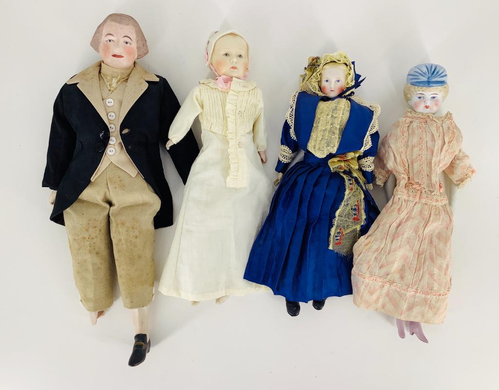 Lot (4) bisque shoulder head dolls. (1 of 1)