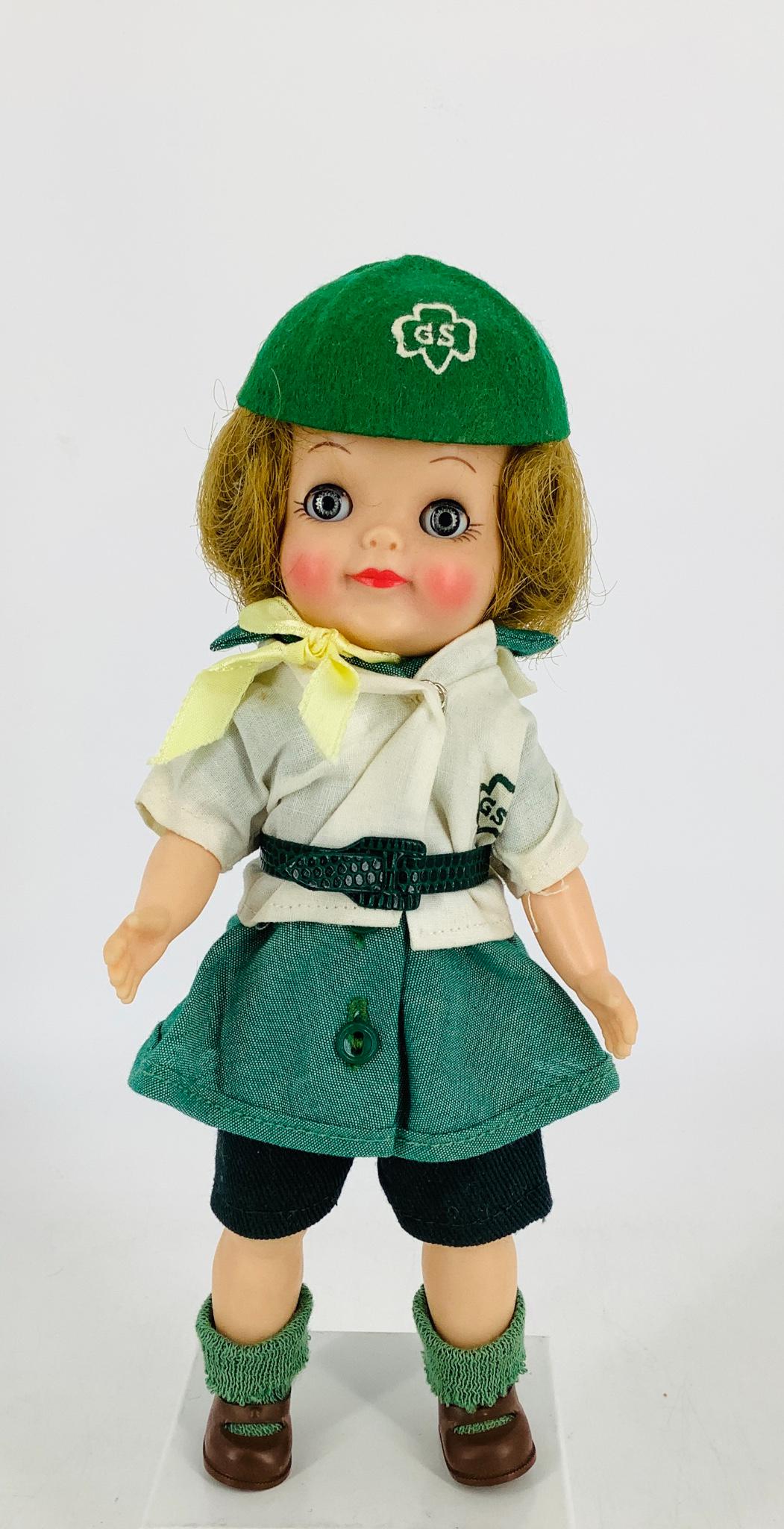 9" Effanbee vinyl "Girl Scout" Doll. Original untagged: 9" Effanbee vinyl "Girl Scout" Doll. Original untagged clothes, glass sleepy eyes with lashes, rooted synthetic wig and jointed arms and legs. In original box (no lid).
