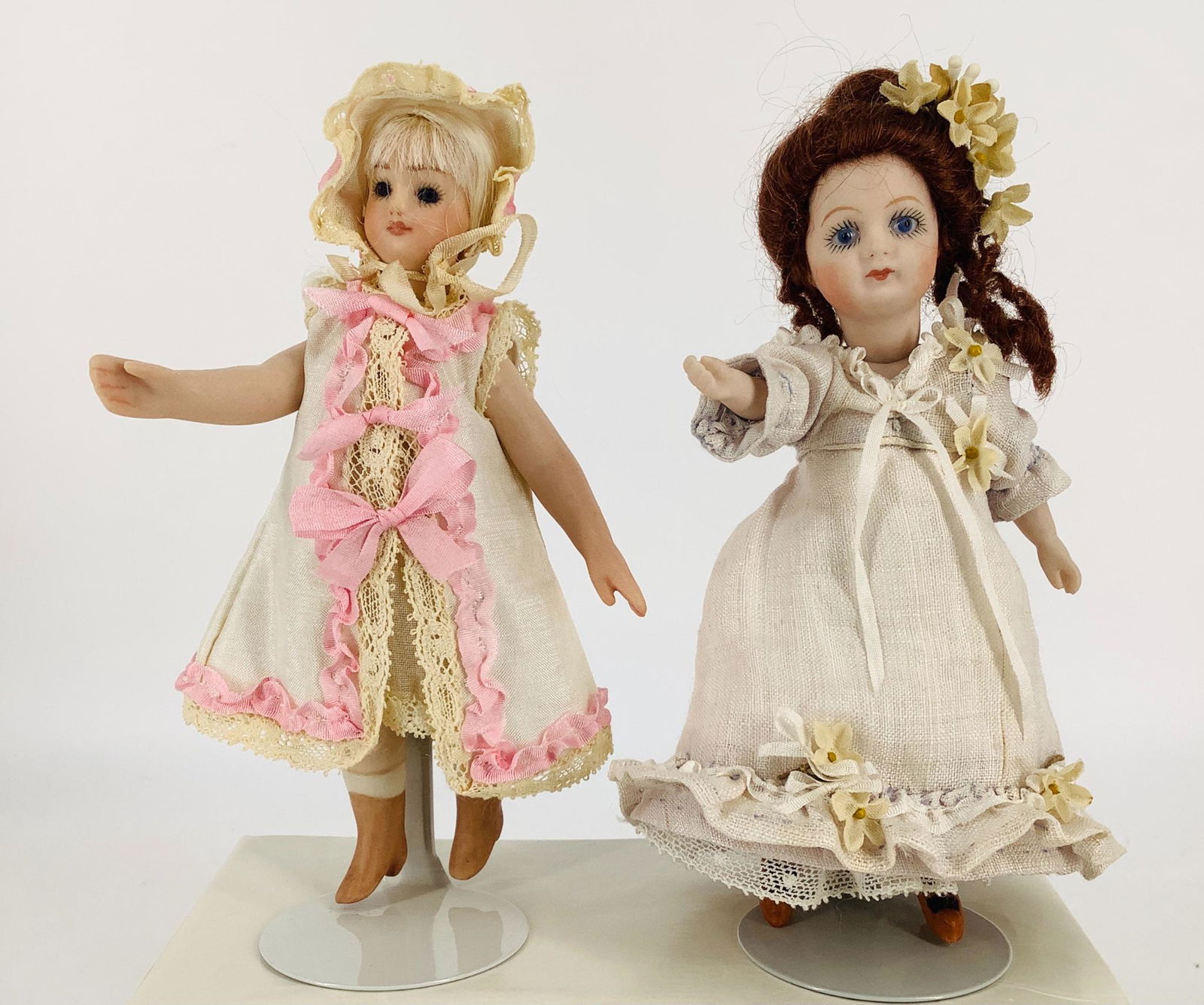 (2) 5 1/4" reproduction all-bisque mignonnettes. Both (1 of 3)