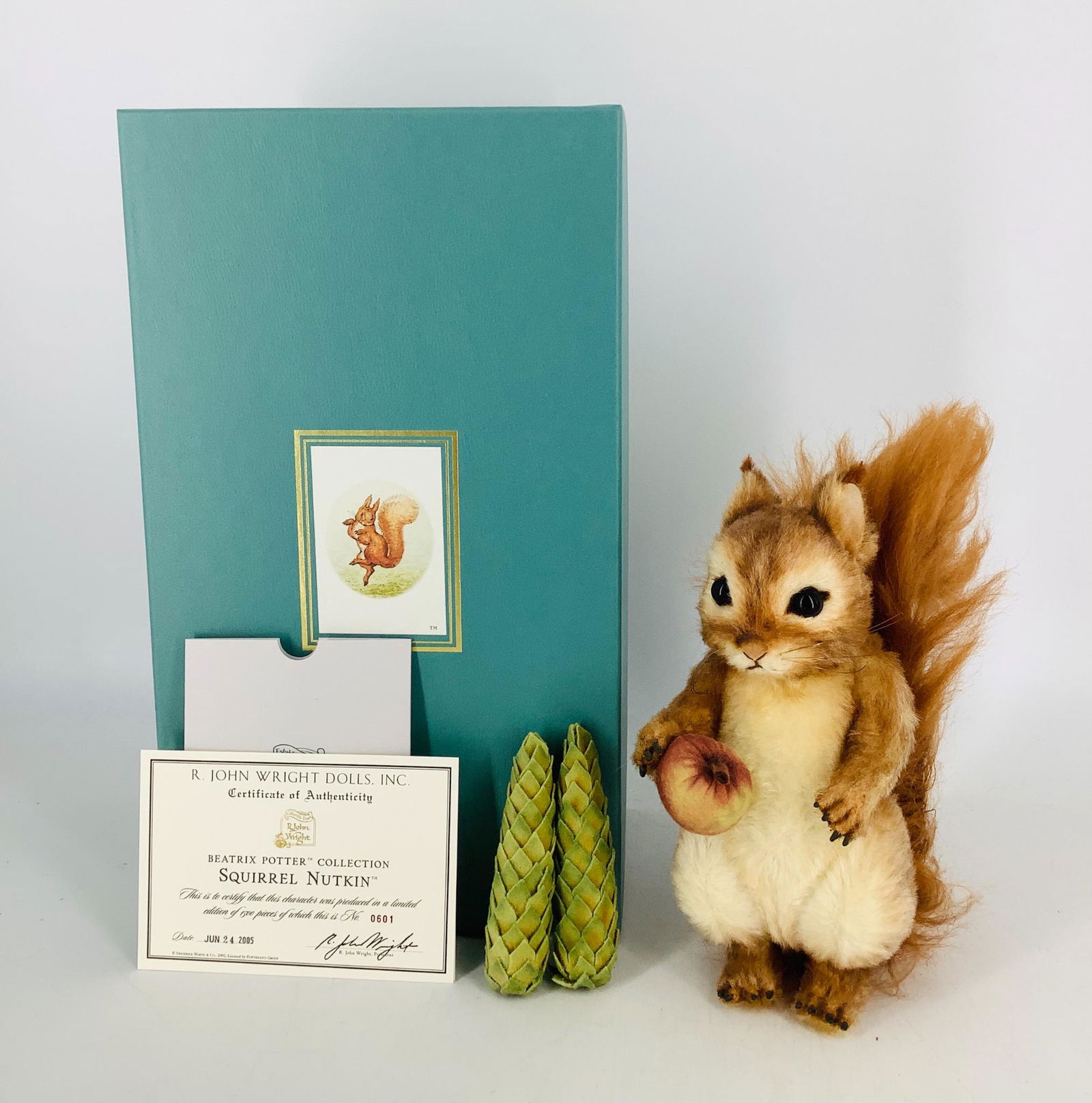 Squirrel Nutkin by R. John Wright. From the Beatrix: Squirrel Nutkin by R. John Wright. From the Beatrix Potter Collection, 9" fully-jointed mohair squirrel with embroidered features and glass eyes, comes with a felt crabapple and two felt pinecones. Li