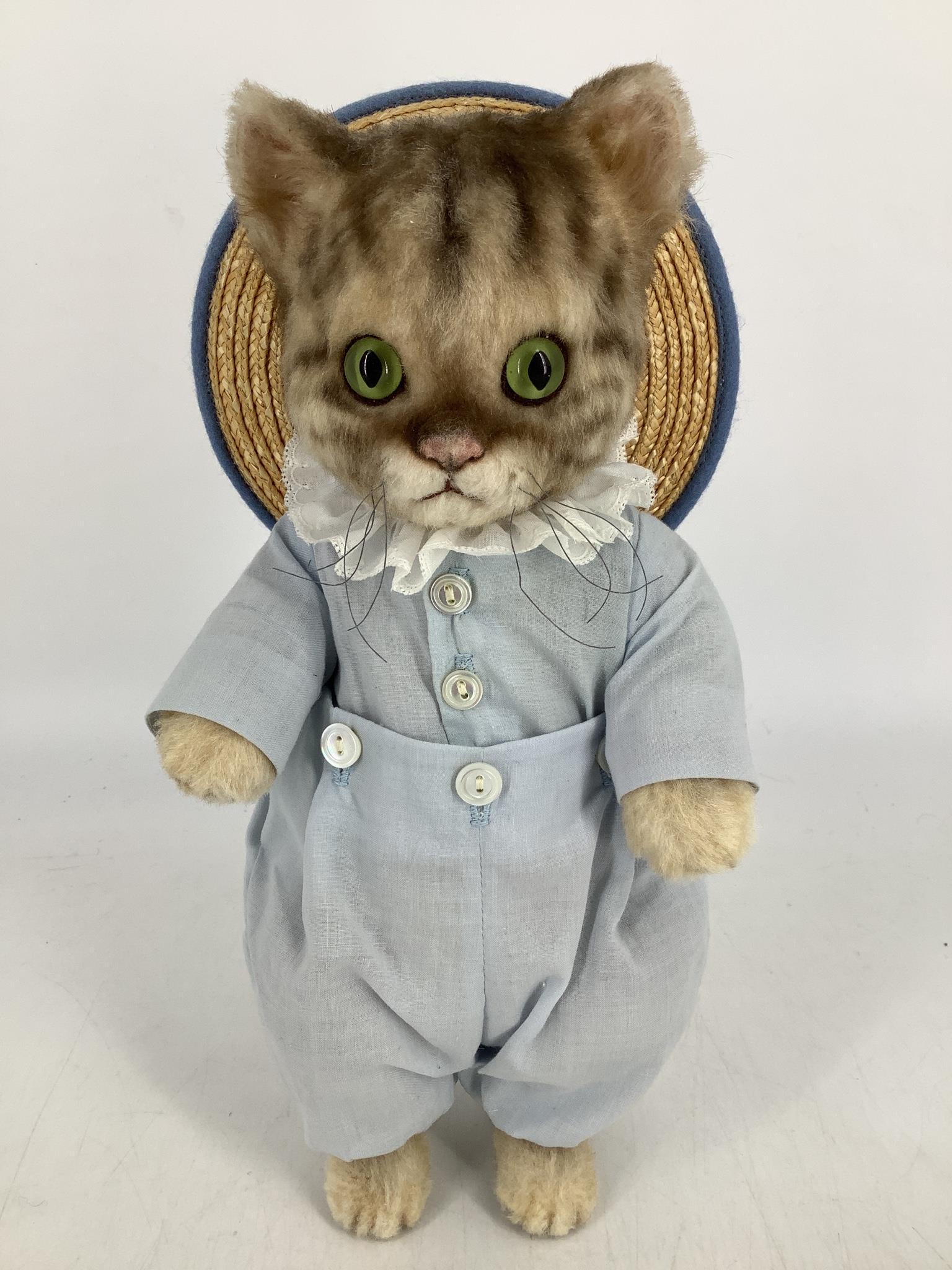 Mohair plush "Tom Kitten" by R. John Wright. From the: Mohair plush "Tom Kitten" by R. John Wright. From the Beatrix Potter collection, Tom is 11" tall and fully jointed with embroidered features, felt paw pads and glass eyes. He is dressed in his two-pie