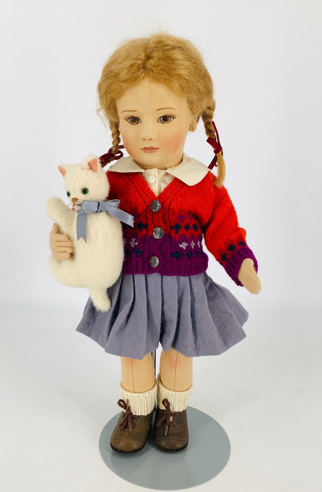 All felt artist doll "Lisa" by R. John Wright. 17" with: All felt artist doll "Lisa" by R. John Wright. 17" with molded and painted facial features, applied ears, mohair wig, on five-piece body with disk jointed arms and legs. Lisa wears her original clothi