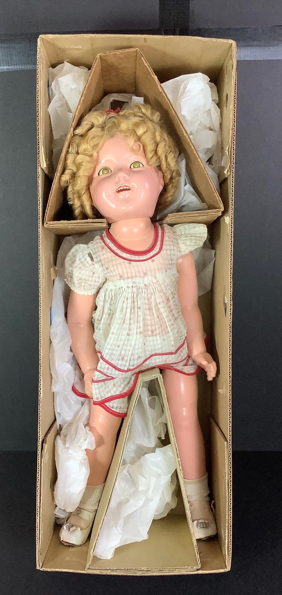 Ideal composition Shirley Temple in original: Ideal composition Shirley Temple in original nondescript box. 24" doll with mohair wig in original set, flirty sleep eyes, open mouth with teeth, on five-piece body. Wears original dress, center snap