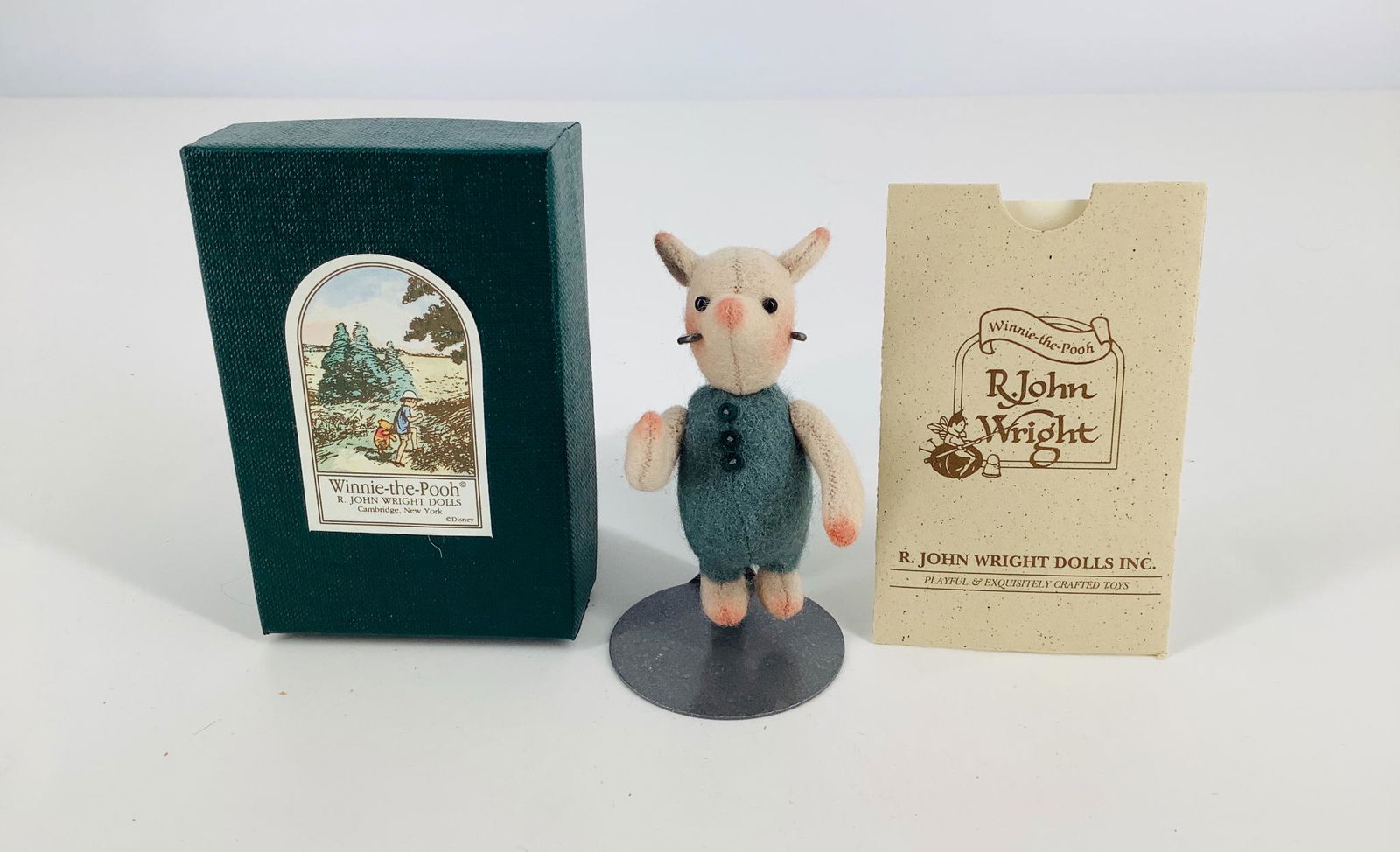 Winnie-the-Pooh "Pocket Piglet" by R. John Wright. All: Winnie-the-Pooh "Pocket Piglet" by R. John Wright. All felt Piglet is 2 3/4" tall, jointed at the neck and shoulders, glass bead eyes. Piglet is Limited Edition No. 2130/3500 and comes in his original