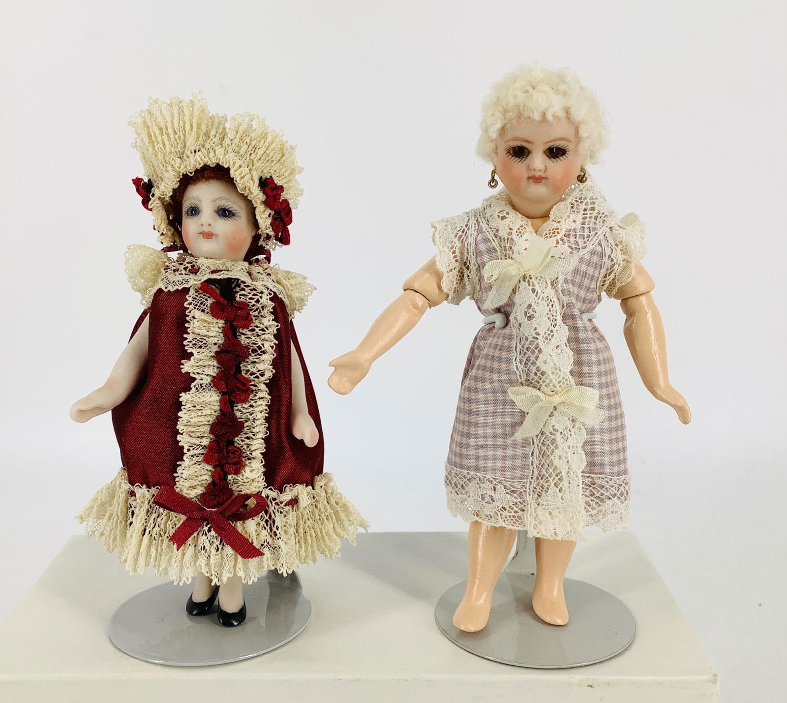 (2) small reproduction French type socket head dolls. (1 of 3)