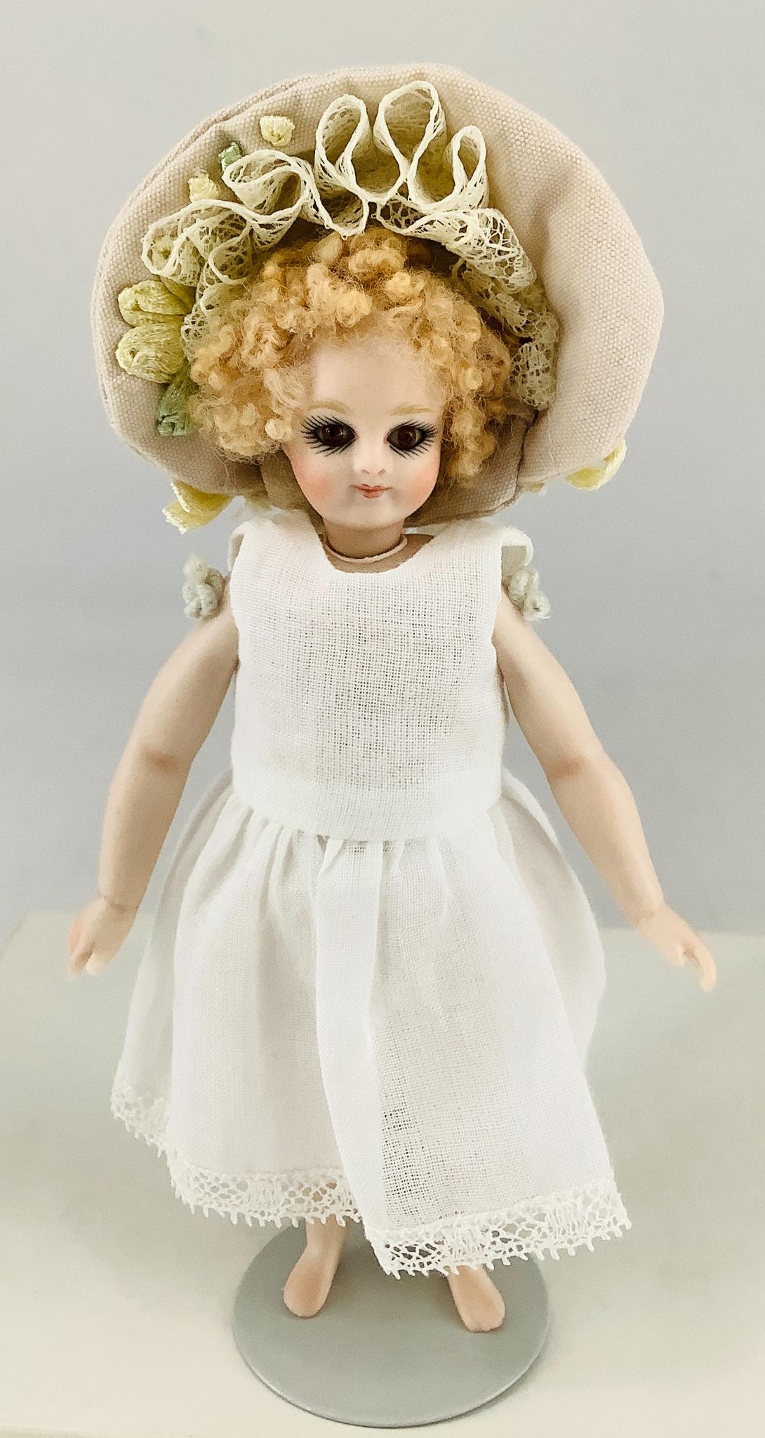 Reproduction all-bisque Mignonnette. 5 1/2" socket head (1 of 3)