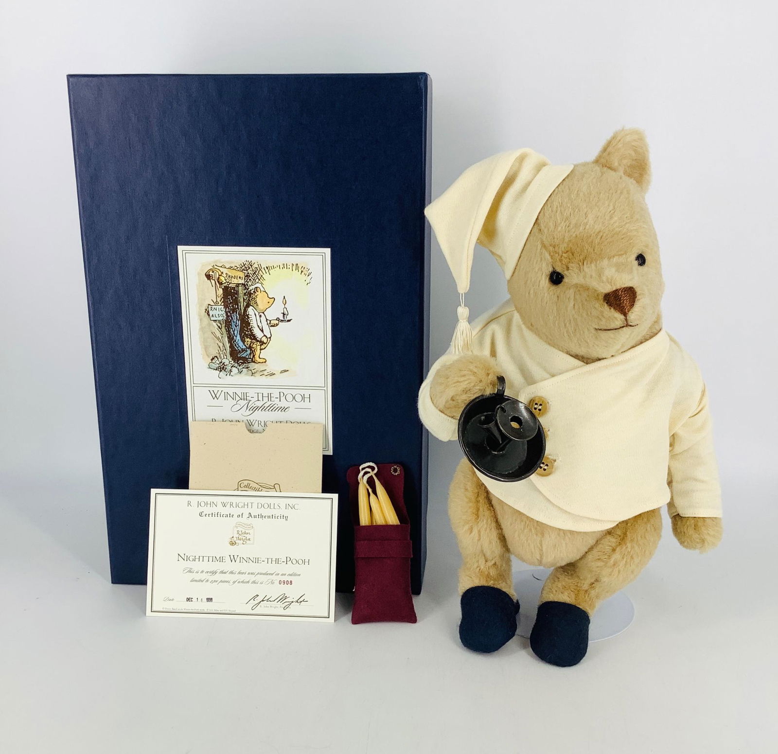 "Nighttime Winnie-the-Pooh" by R. John Wright. 12": "Nighttime Winnie-the-Pooh" by R. John Wright. 12" fully jointed mohair plush Pooh has glass eyes and embroidered nose. He wears his cotton nightshirt, cap and felt and leather slippers and carries is
