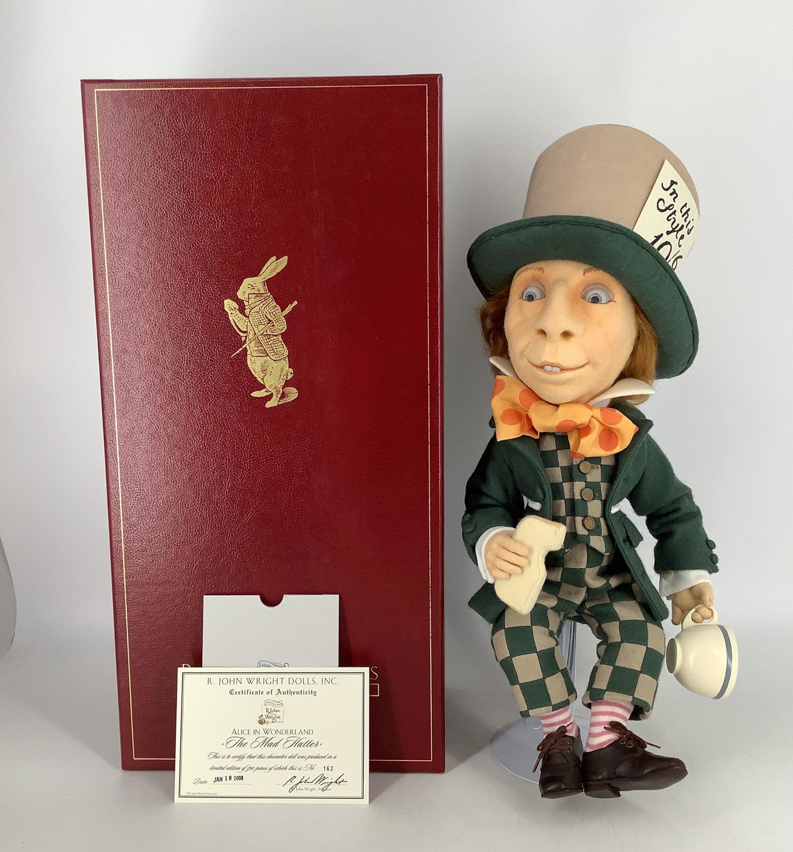 "The Mad Hatter" by R. John Wright. From the Alice in: "The Mad Hatter" by R. John Wright. From the Alice in Wonderland collection, 16" (excluding hat) Mad Hatter is all felt, fully jointed, with molded and painted character head, intaglio eyes, mohair wi