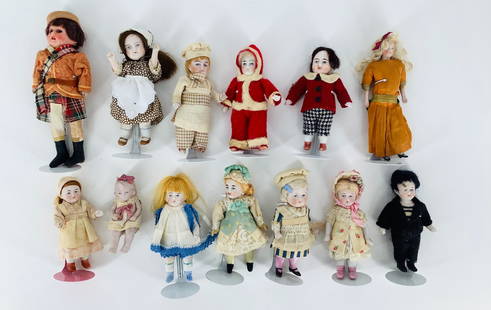 Lot (13) bisque dolls ranging in size from 3 1/2" - 7": Lot (13) bisque dolls ranging in size from 3 1/2" - 7" tall. (1) has glass eyes and some have hair. All in good condition.