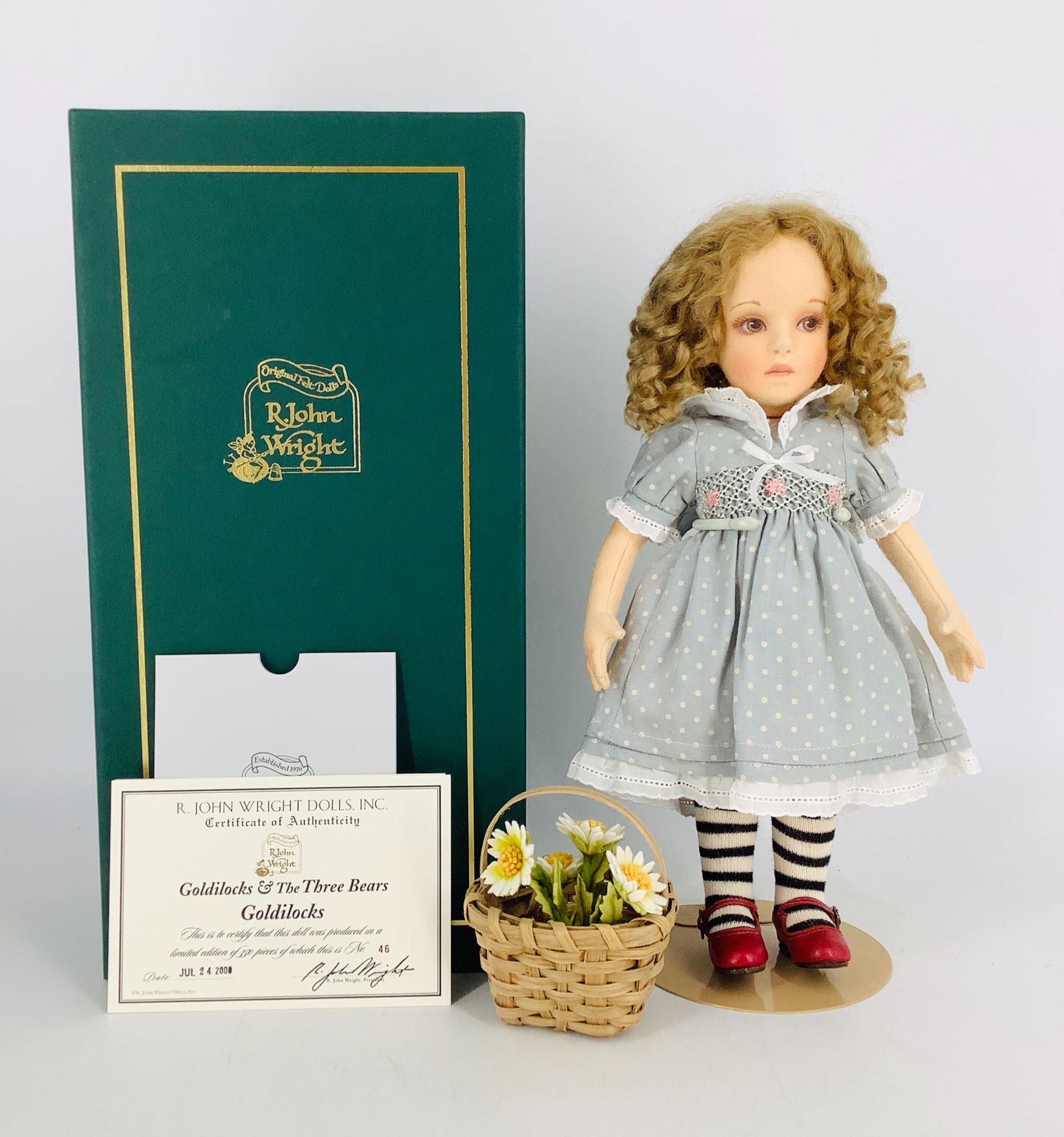 "Goldilocks" by R. John Wright. 12 1/4" all felt doll: "Goldilocks" by R. John Wright. 12 1/4" all felt doll with molded and painted facial features, mohair wig, on fully jointed body. Goldilocks wears a light blue cotton dress with a hand smocked bodice,