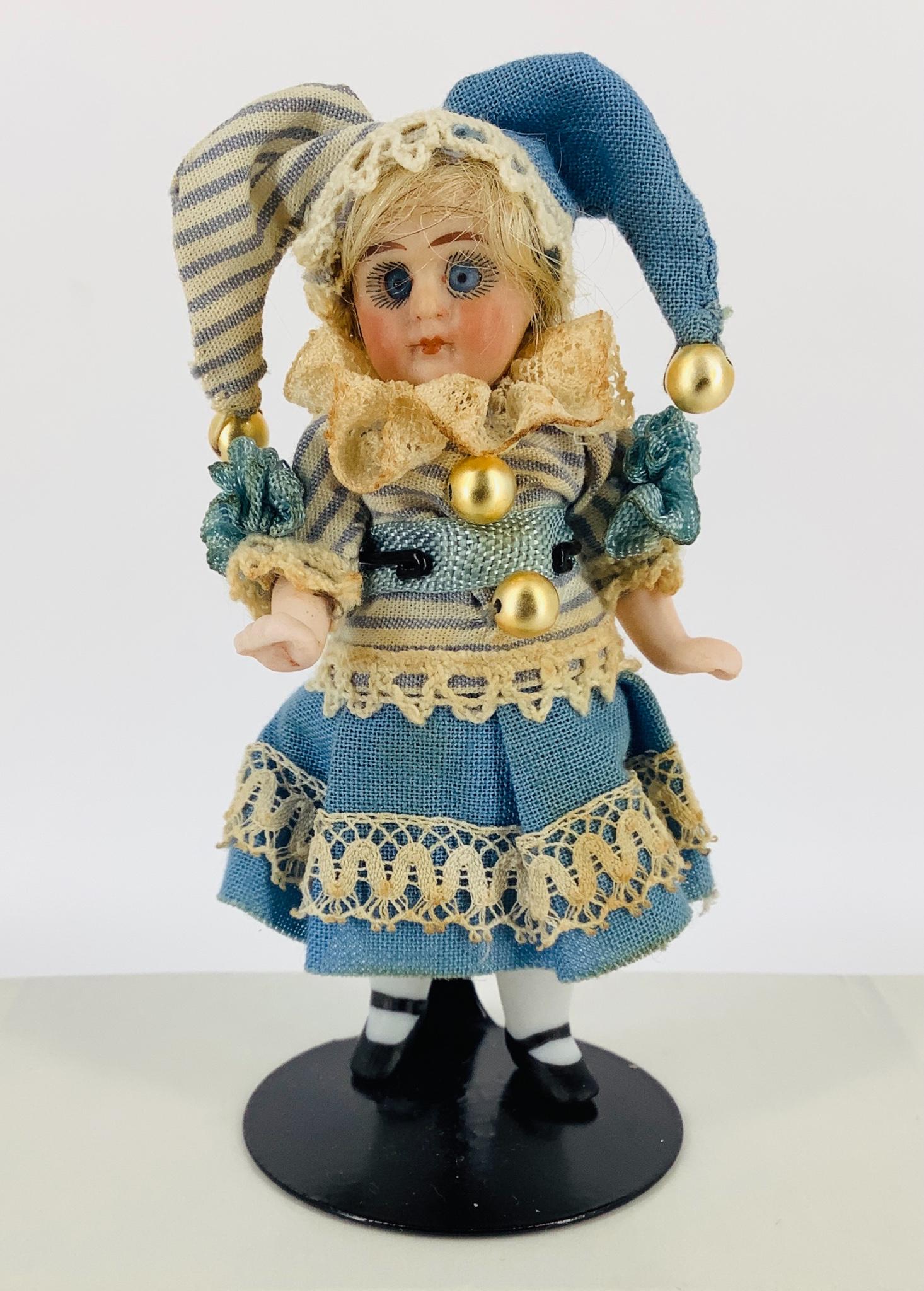 All-bisque girl jester. 3 3/4" to top of head, bisque (1 of 2)