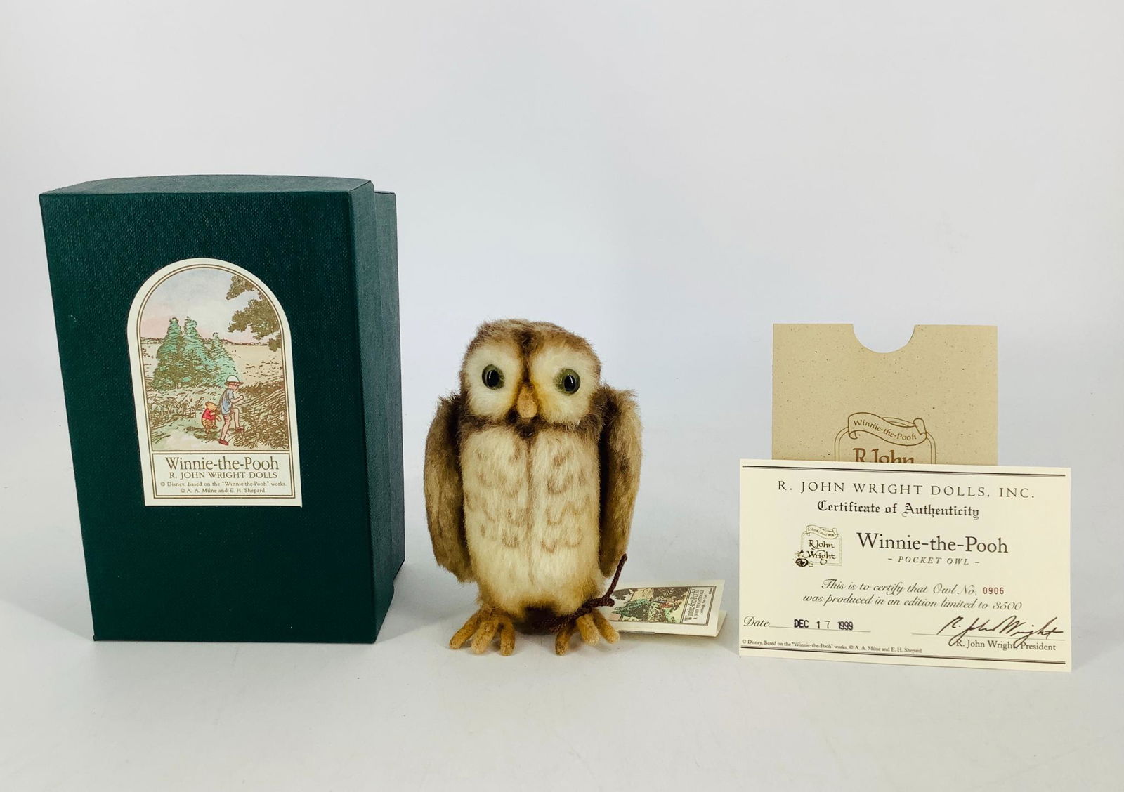 Winnie-the-Pooh "Pocket Owl" by R. John Wright. 4 1/2": Winnie-the-Pooh "Pocket Owl" by R. John Wright. 4 1/2" mohair plush Owl, jointed at the neck with moveable wings, glass eyes. Owl is Limited Edition No. 908/3500 and comes in his original box with COA