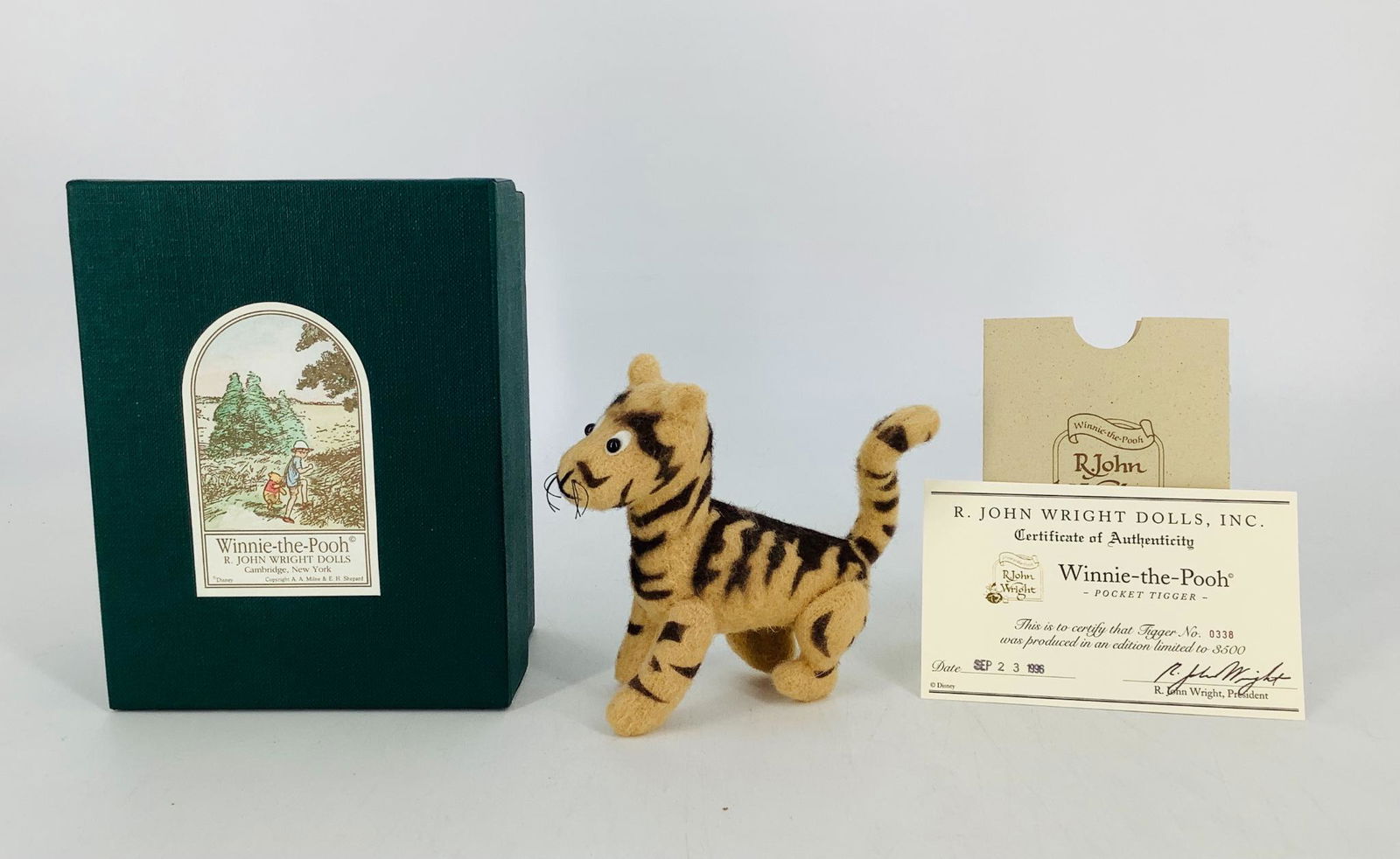 Winnie-the-Pooh "Pocket Tigger" by R. John Wright.: Winnie-the-Pooh "Pocket Tigger" by R. John Wright. Fourth in the Pocket series, 3 1/2" tall Tigger is fully jointed mohair plush with felt-backed glass eyes and embroidered features. He is Limited Edi