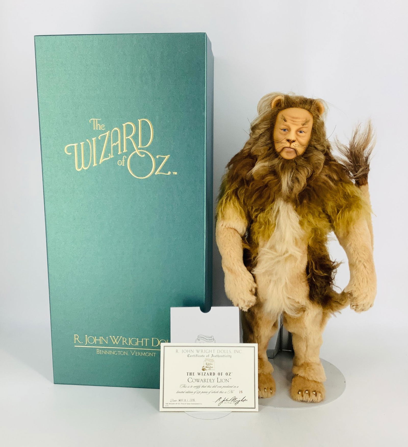 "Cowardly Lion" by R. John Wright. From the Wizard of: "Cowardly Lion" by R. John Wright. From the Wizard of Oz collection the all felt fully jointed Lion is 17" tall with painted features. He is dressed in an authentically detailed costume made of mohair