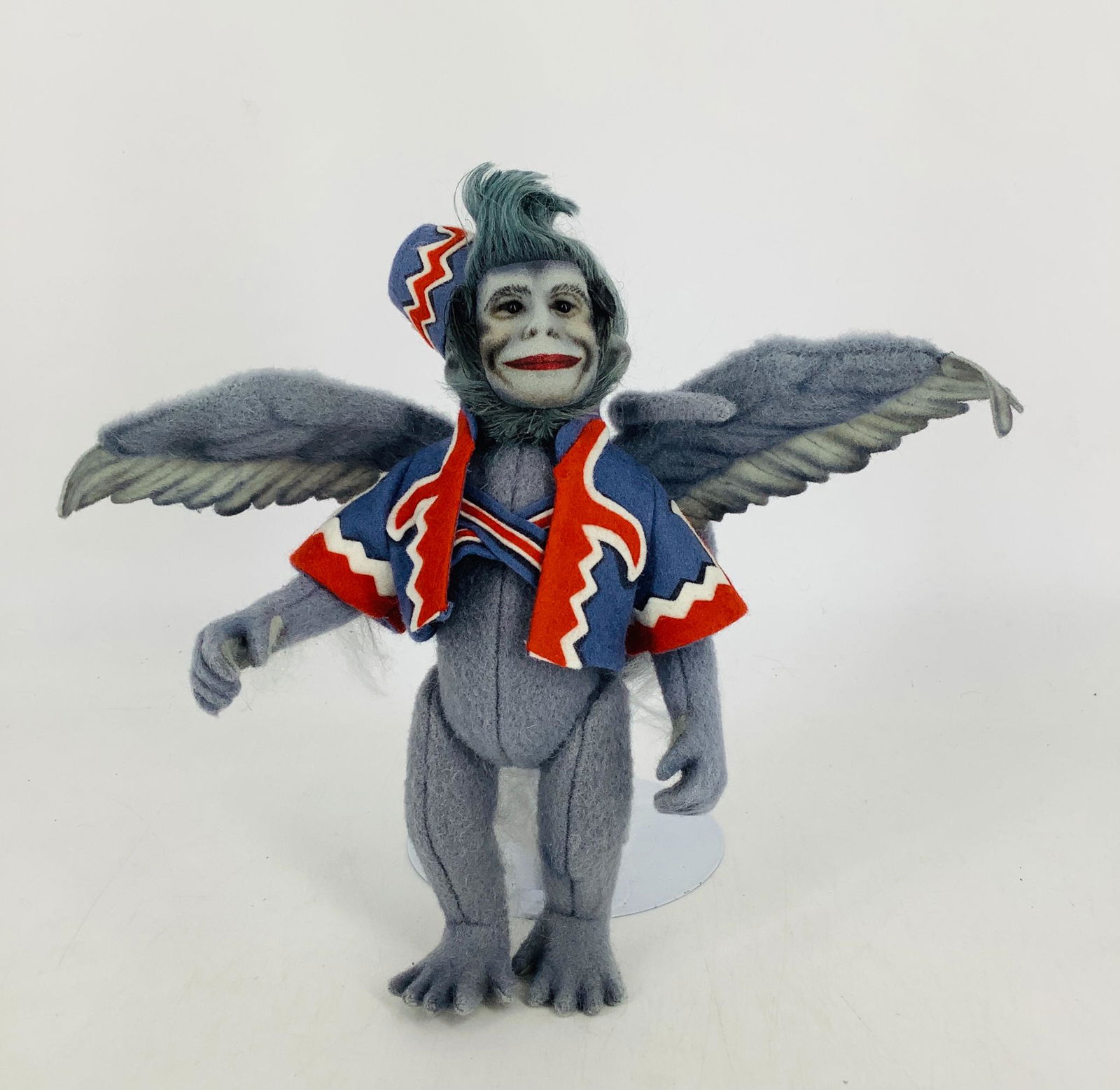 All wool felt "Winged Monkey" by R. John Wright. From: All wool felt "Winged Monkey" by R. John Wright. From the Wizard of Oz series, 8 1/2" overall, wool with felt detailing, fully jointed, painted facial features, glass bead eyes, authentic felt costume