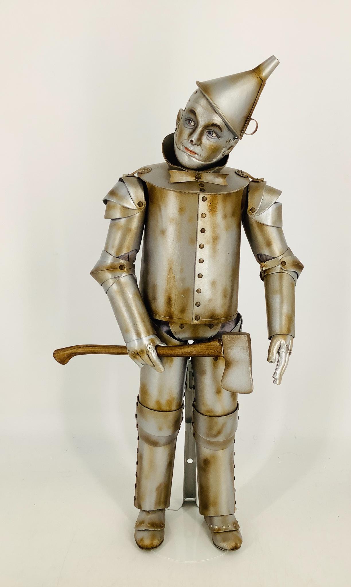 "The Tin Man" by R. John Wright. From the Wizard of Oz: "The Tin Man" by R. John Wright. From the Wizard of Oz collection, the Tin Man is an 18" tall all felt doll jointed at the neck, shoulders, elbows, hips and knees with a ball and socket jointing syste
