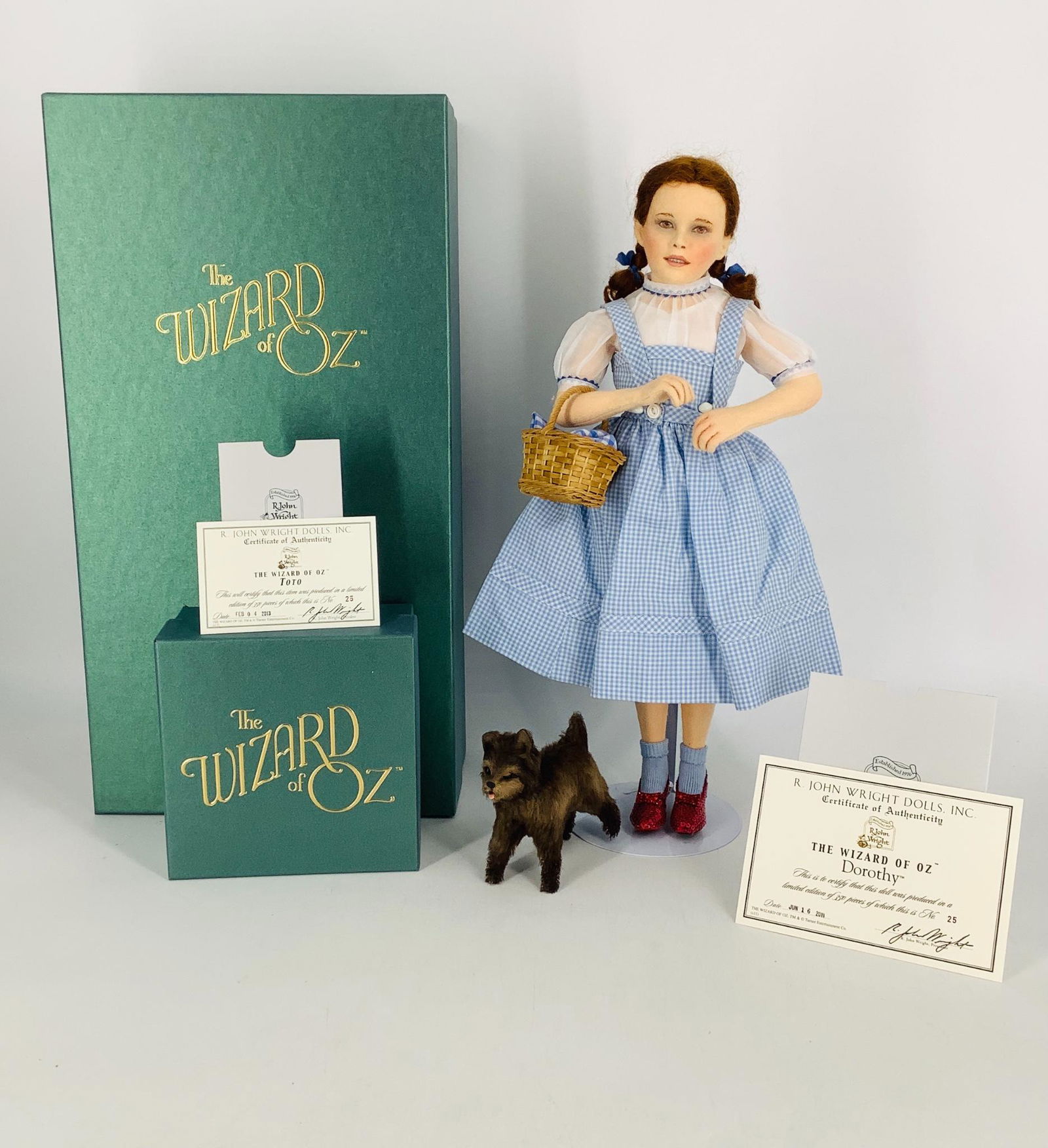 "Dorothy" and "Toto" by R. John Wright. From the Wizard: "Dorothy" and "Toto" by R. John Wright. From the Wizard of Oz collection, 16" Dorothy is all felt with molded and painted facial features, mohair wig, jointed at neck, shoulders and hips. Her costume