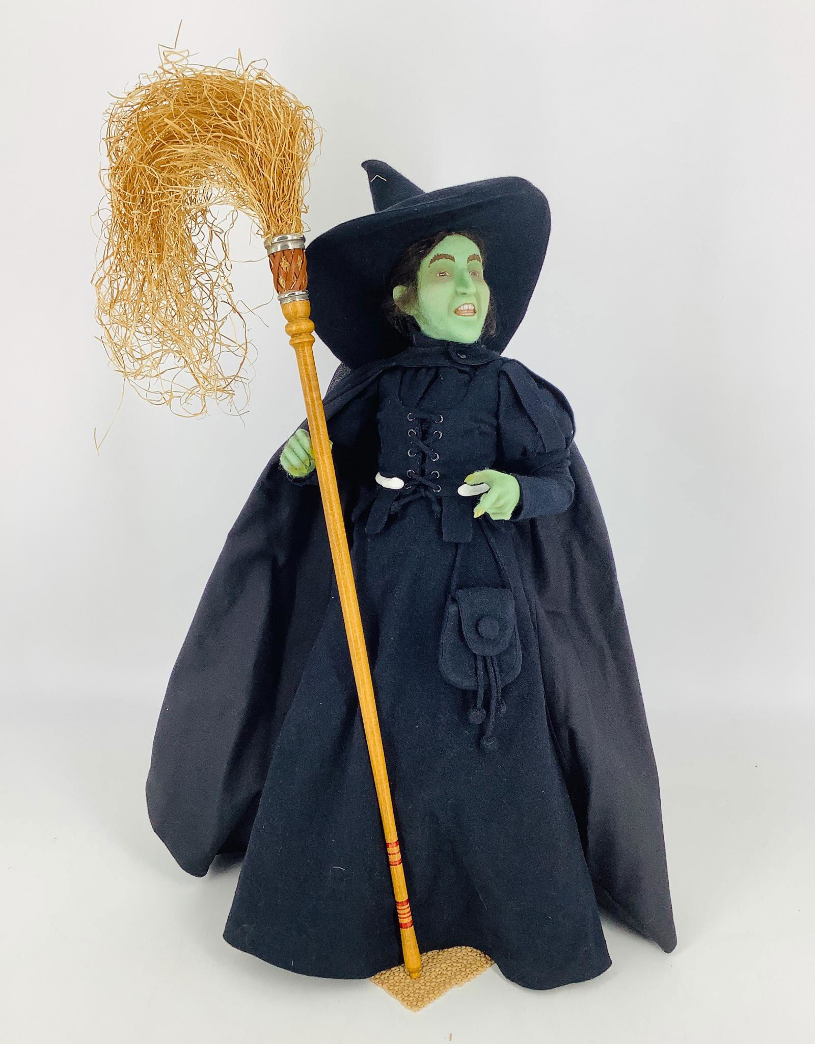"Wicked Witch of the West" by R. John Wright. From the: "Wicked Witch of the West" by R. John Wright. From the Wizard of Oz collection, the all wool felt witch is 17" tall and is jointed at the neck, shoulders and hips with R. John Wright's ball and socket