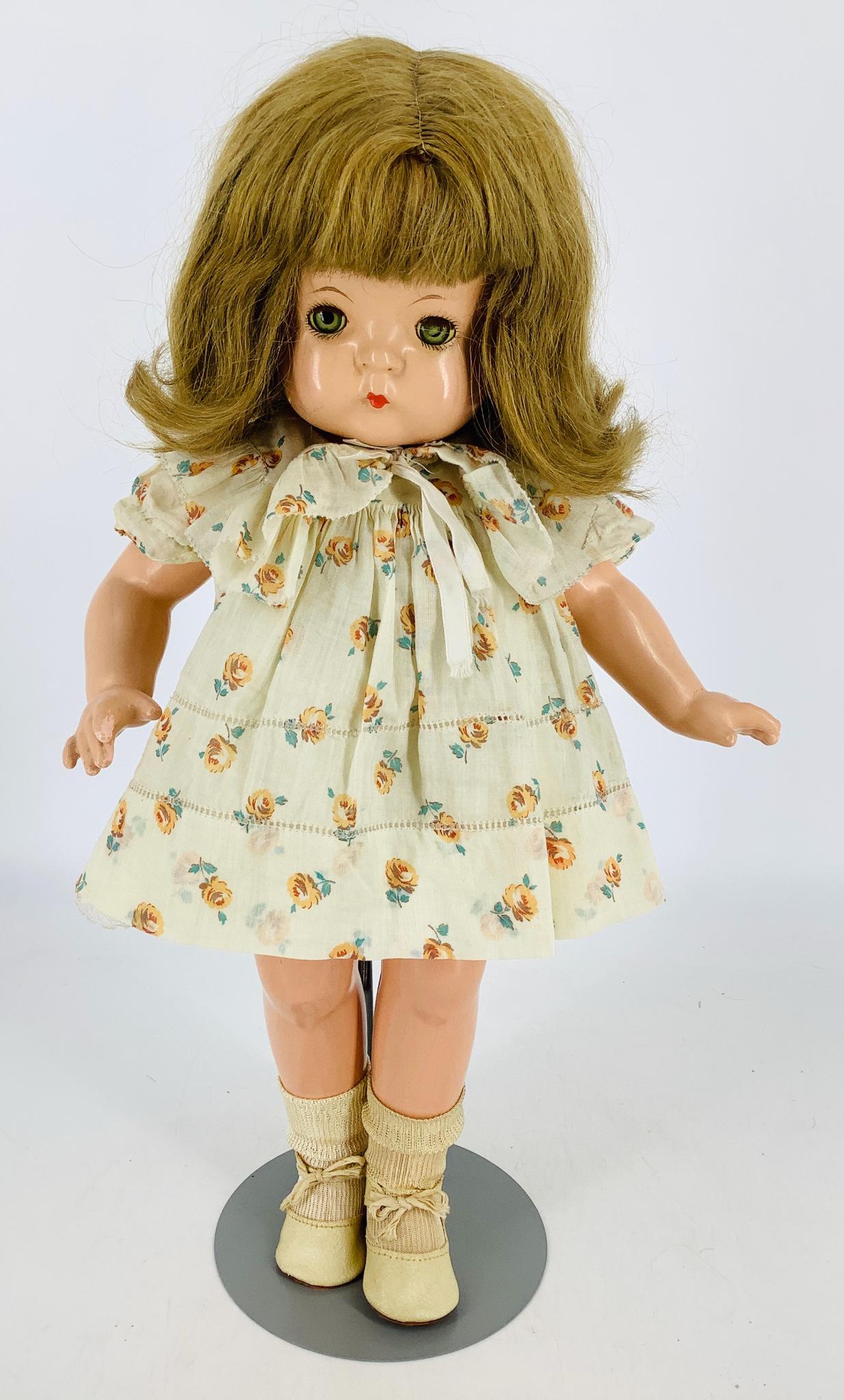 Effanbee composition "Patsy-Ann". 19" doll with human: Effanbee composition "Patsy-Ann". 19" doll with human hair wig over molded hair, sleep eyes with eyelashes, small closed mouth, on five-piece body. Appropriately dressed. Left eye is cloudy, light ove