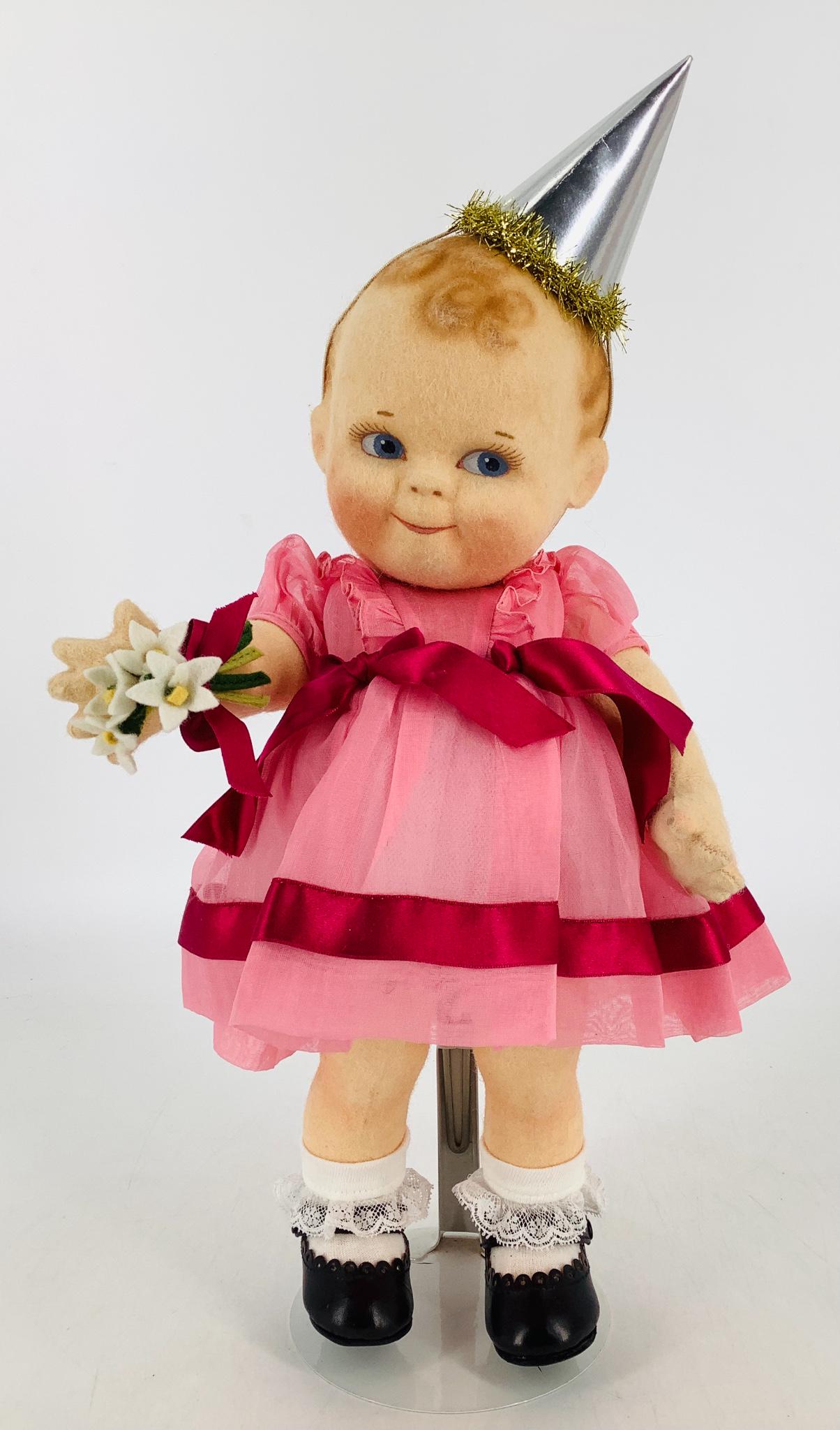 All felt "Scootles" girl by R. John Wright. Molded and: All felt "Scootles" girl by R. John Wright. Molded and painted hair and facial features, on five-piece body with starfish hands. 13" doll is dressed in her organdy party dress with bouquet of flowers