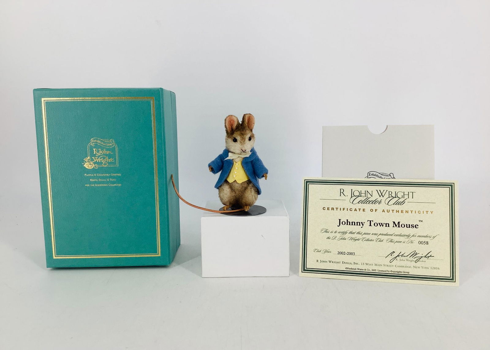 "Johnny Town Mouse" by R. John Wright. Made exclusively: "Johnny Town Mouse" by R. John Wright. Made exclusively for the R. John Wright Collector Club (2002/2003), the 3" mohair mouse has joints at the neck and arms, glass bead eyes, resin hands and feet an