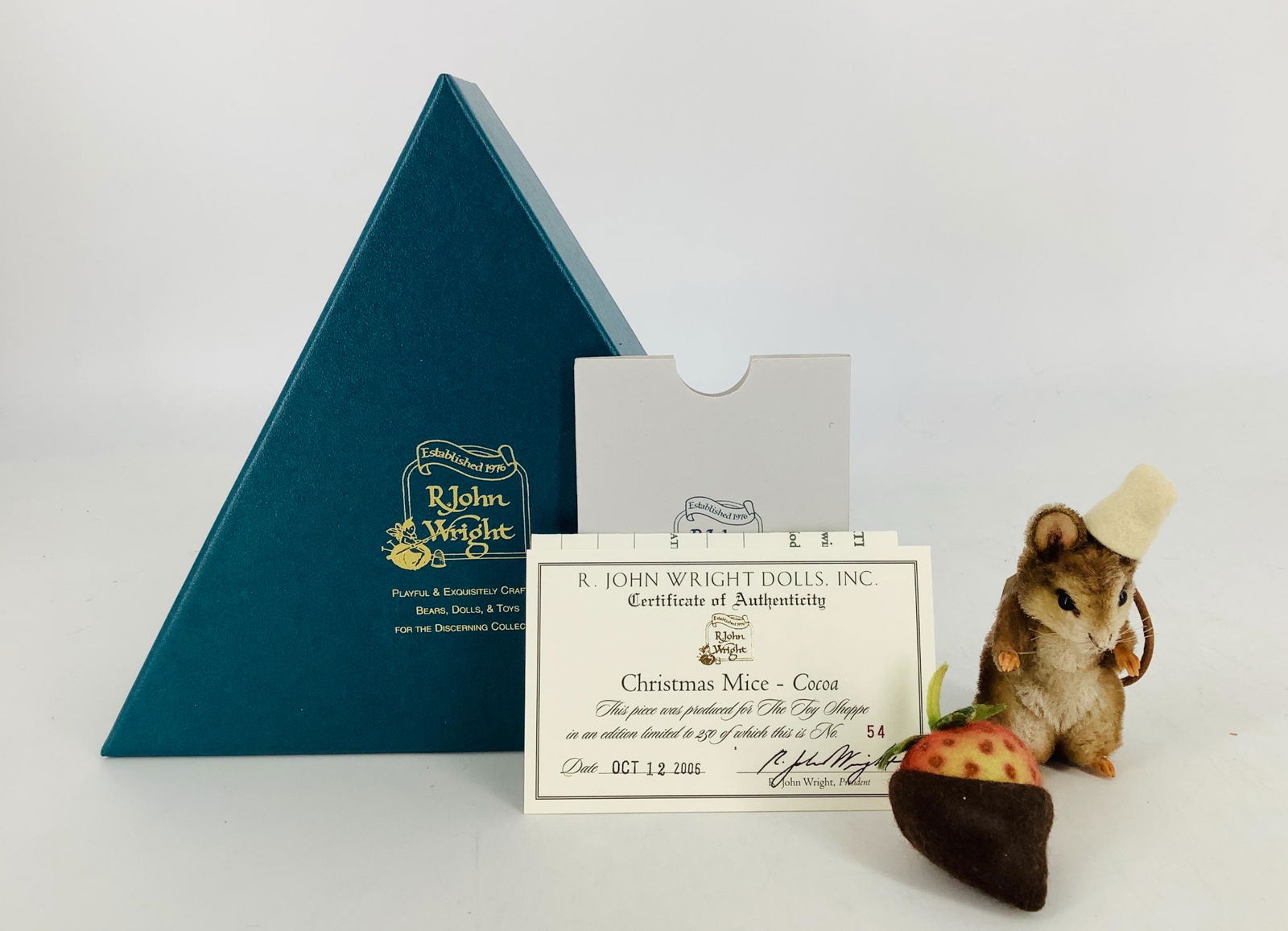 Mohair "Christmas Mice - Cocoa" by R. John Wright. Made: Mohair "Christmas Mice - Cocoa" by R. John Wright. Made exclusively for The Toy Shoppe, Cocoa is 3" tall to the top of his ears and is jointed at the neck and shoulders. He comes with a "chocolate cov