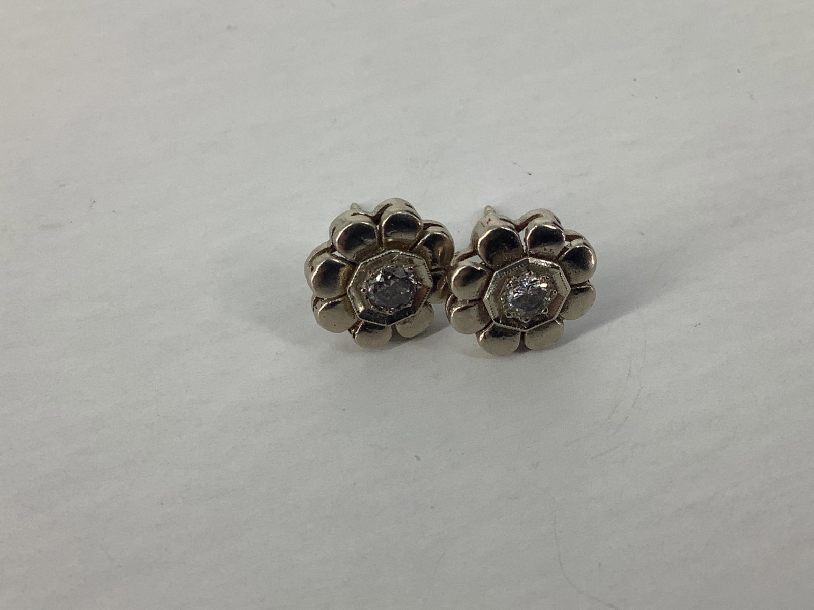 Diamond Earrings: Diamond Earrings 14kt white gold, pierced style with post backings, 2.8 grams total weight, 10.75mm in diameter, with 3.5mm/0.34 cttw diamond rounds.