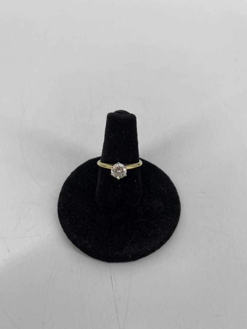 Diamond Solitaire Ring: Diamond Solitaire Ring 14 kt gold (stamped and tested), size 5.25 with straight band and one round brilliant cut diamond solitaire measuring 5.5 mm in diameter (approx. 0.66 cttw). No chips/cracks. No