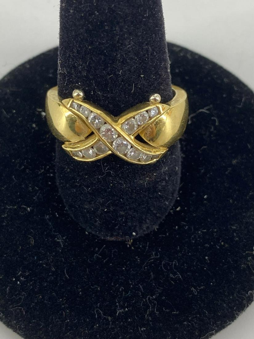 Gold and Diamond Ring: Gold and Diamond Ring 18 kt yellow gold ring size 5.25 with tapered band featuring 14 round diamonds of variant size (between 0.75 mm and 2.25 mm in diameter, approx. 0.48 cttw) in x configuration wit