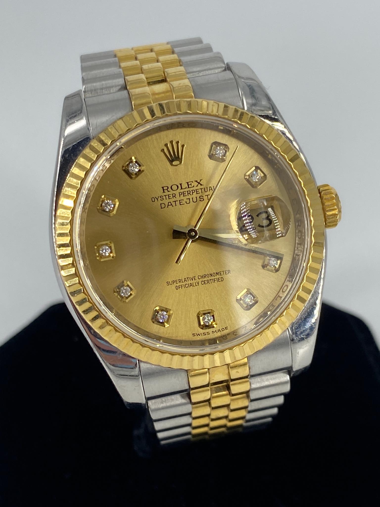 Rolex Wrist Watch: Rolex Wrist Watch Dual tone stainless steel & 18kt yellow gold oyster perpetual date just Rolex. 36mm Jubilee fold over band, fluted bezel & champagne dial, serial #2386216 model #63203. Running at ti