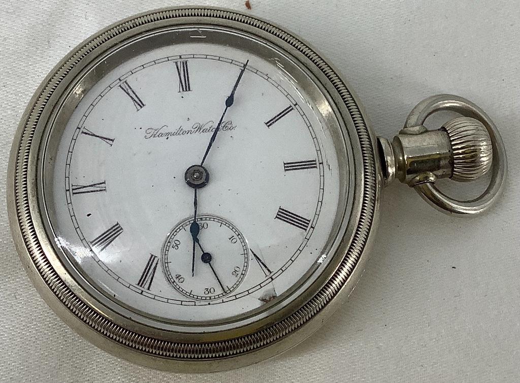 Hamilton Pocket Watch: Hamilton Pocket Watch Lever set, swing-front case. Winds, sets and ticks at time of listing. Some damage to face (white face with roman numeral indicators). Circa 1898, grade 929, size 18s, 15-jewels,