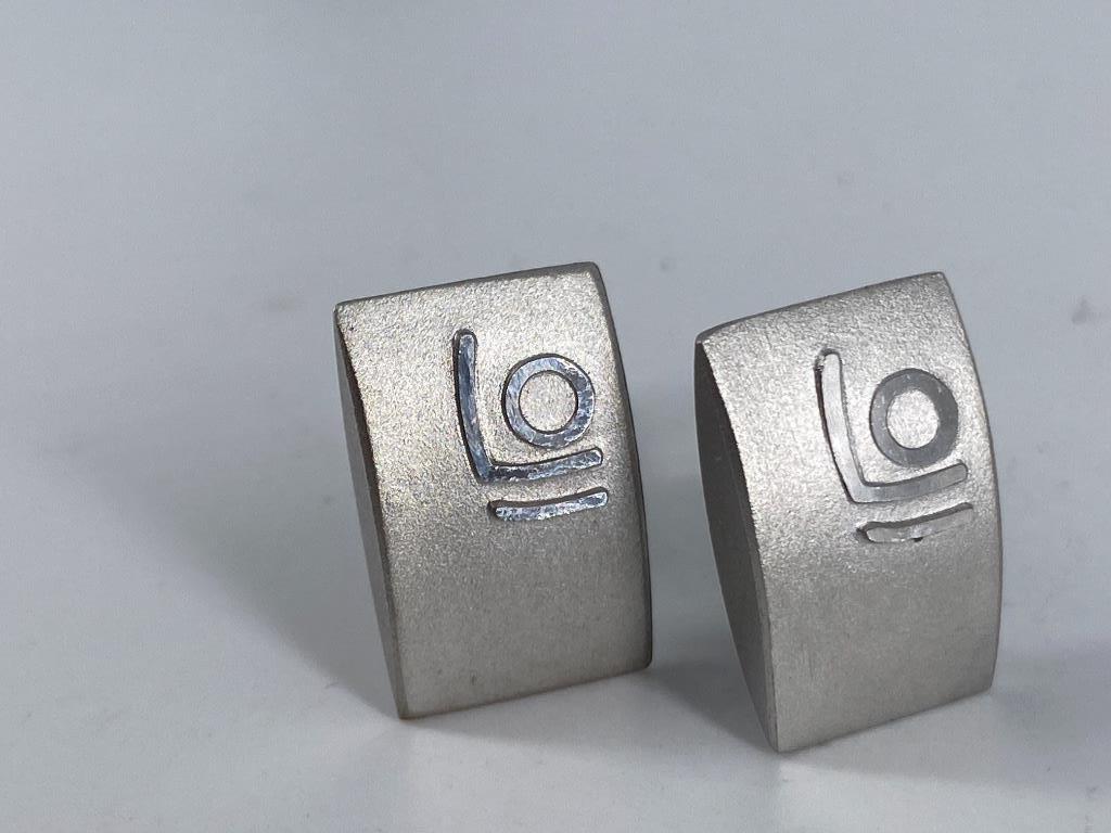 Sterling Silver Cufflinks From Leica: Sterling Silver Cufflinks From Leica Toggle back design featuring a curved rectangular top with a matte finish accented with polished geometric accents, stamped and tested (0.65 troy oz tw)