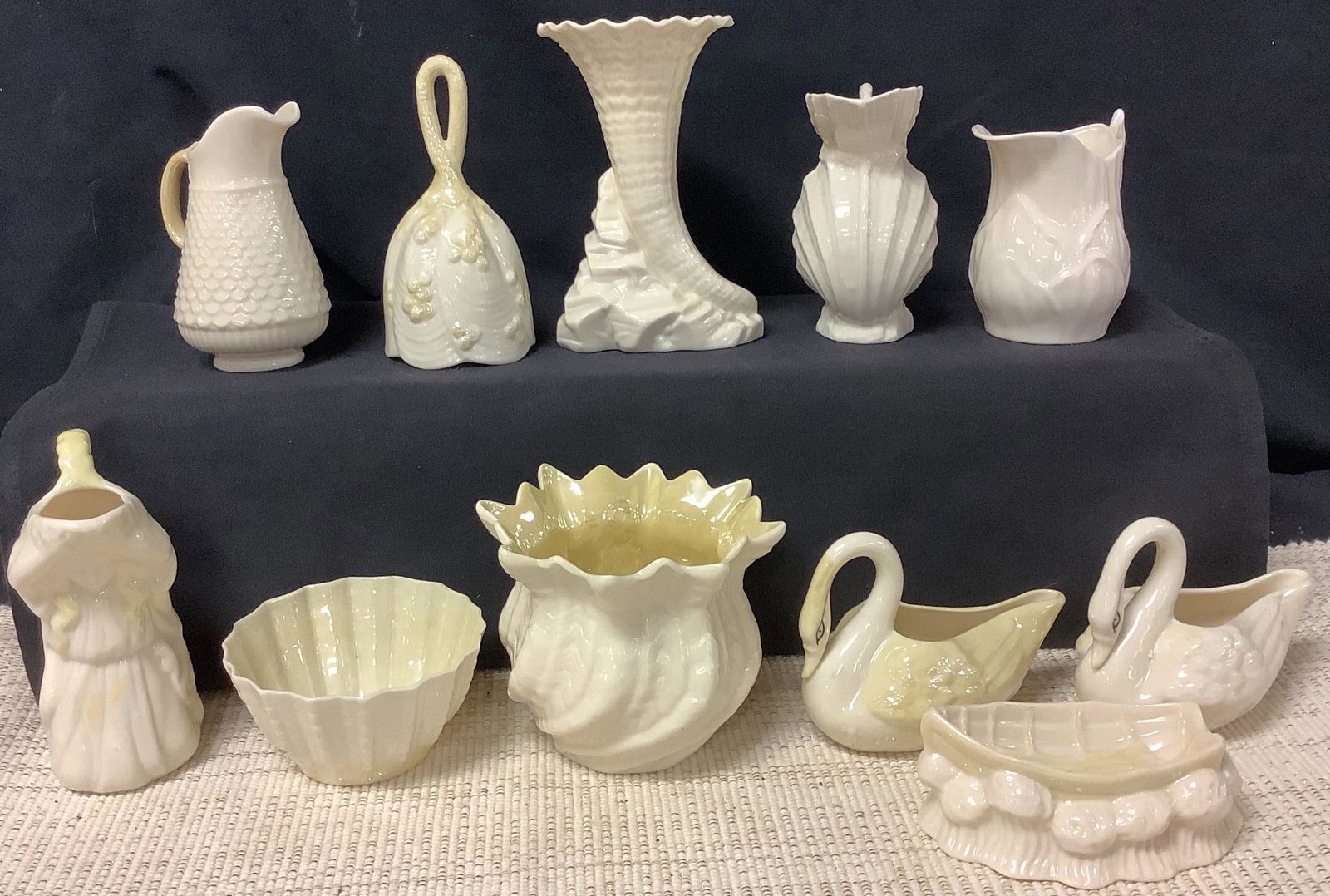 Lot of 11 belleek items including 4 pitchers, 2 swans & (1 of 2)