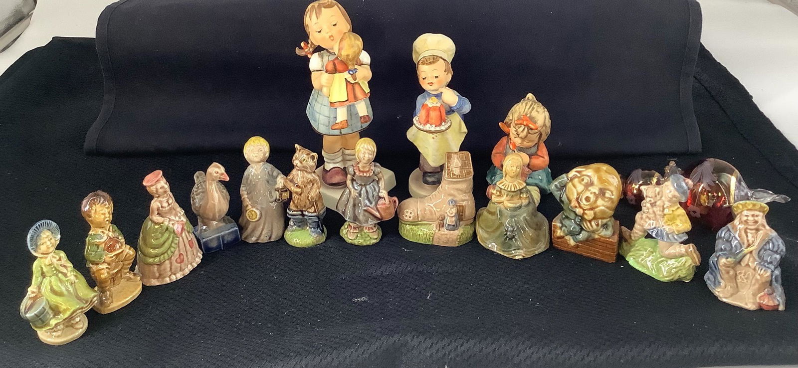 Lot of Wade porcelain Collection set of 12 large: Lot of Wade porcelain Collection set of 12 large nursery rhyme figurines. One blowing glass ornament. 3 Hummel figurine.